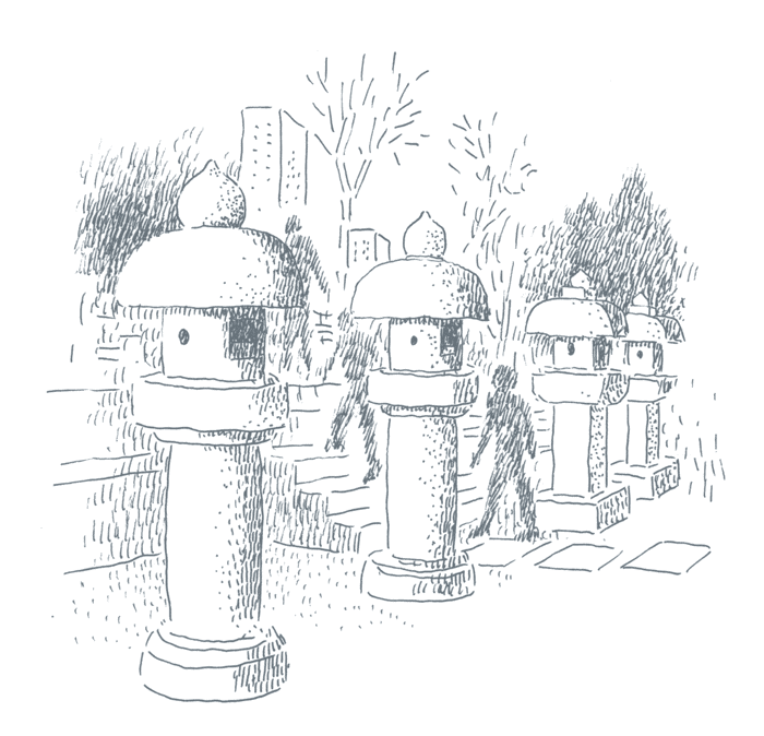 石灯籠が並ぶ墓地